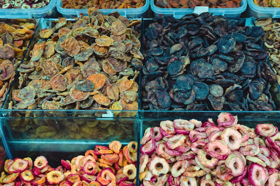An assortment of sun-dried fruits displayed at a traditional market